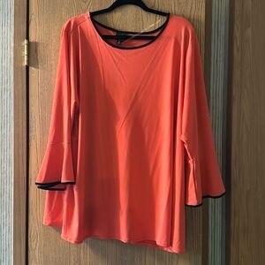 Tangerine and black womans shirt.